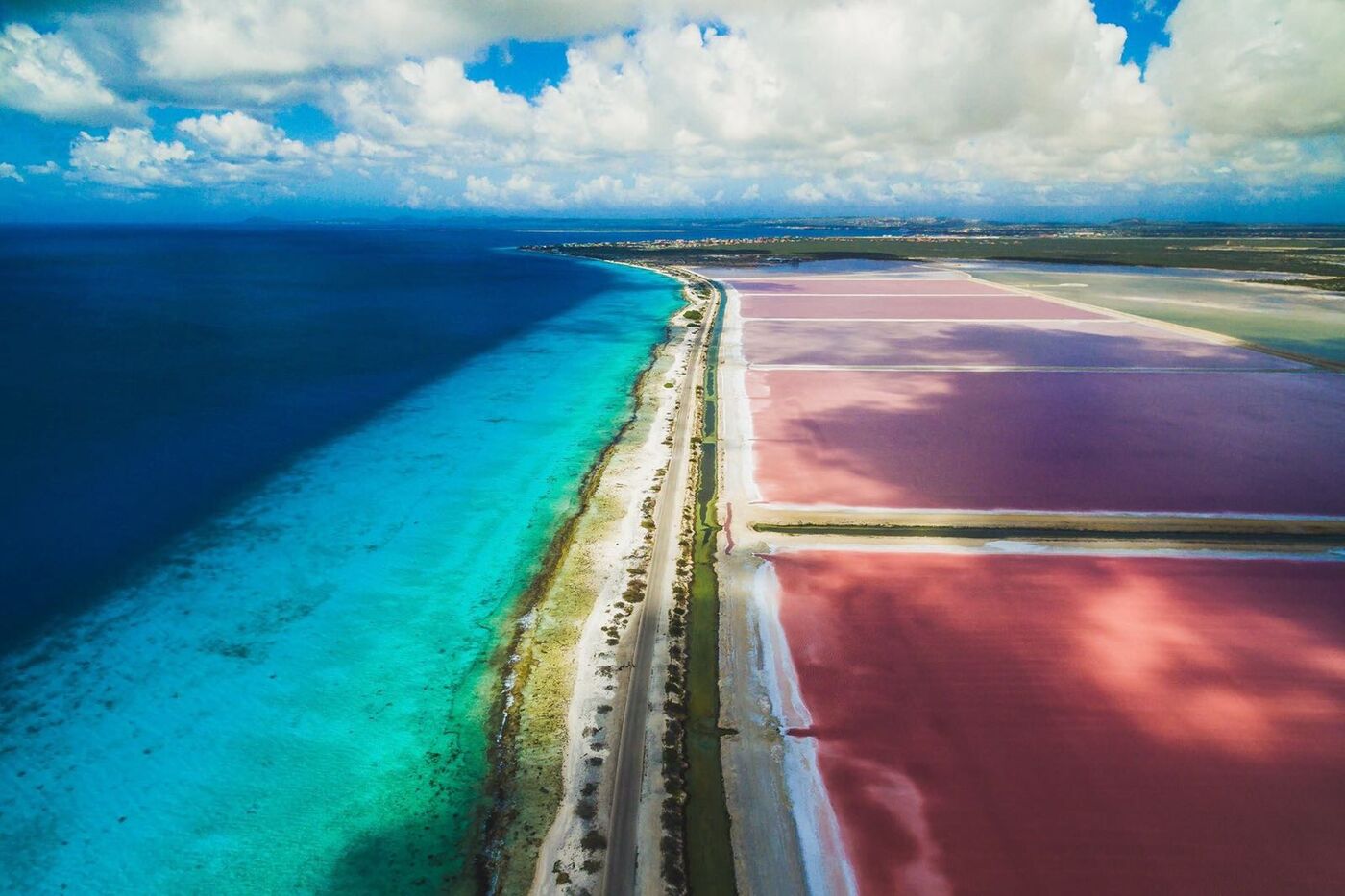 Aerial view of Bonaire’s pink salt pans and coast road